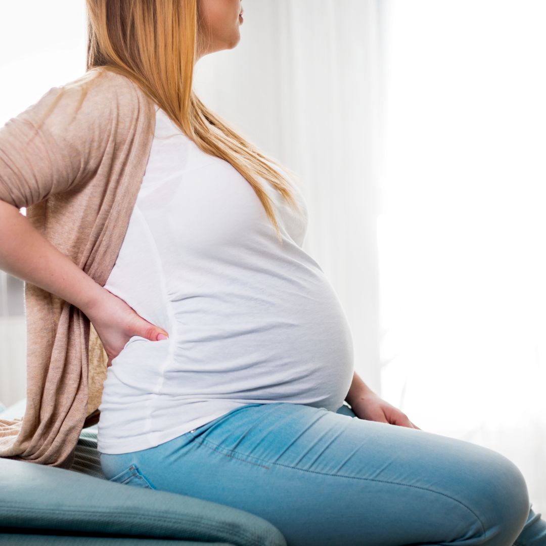 woman with back pain due to pregnancy